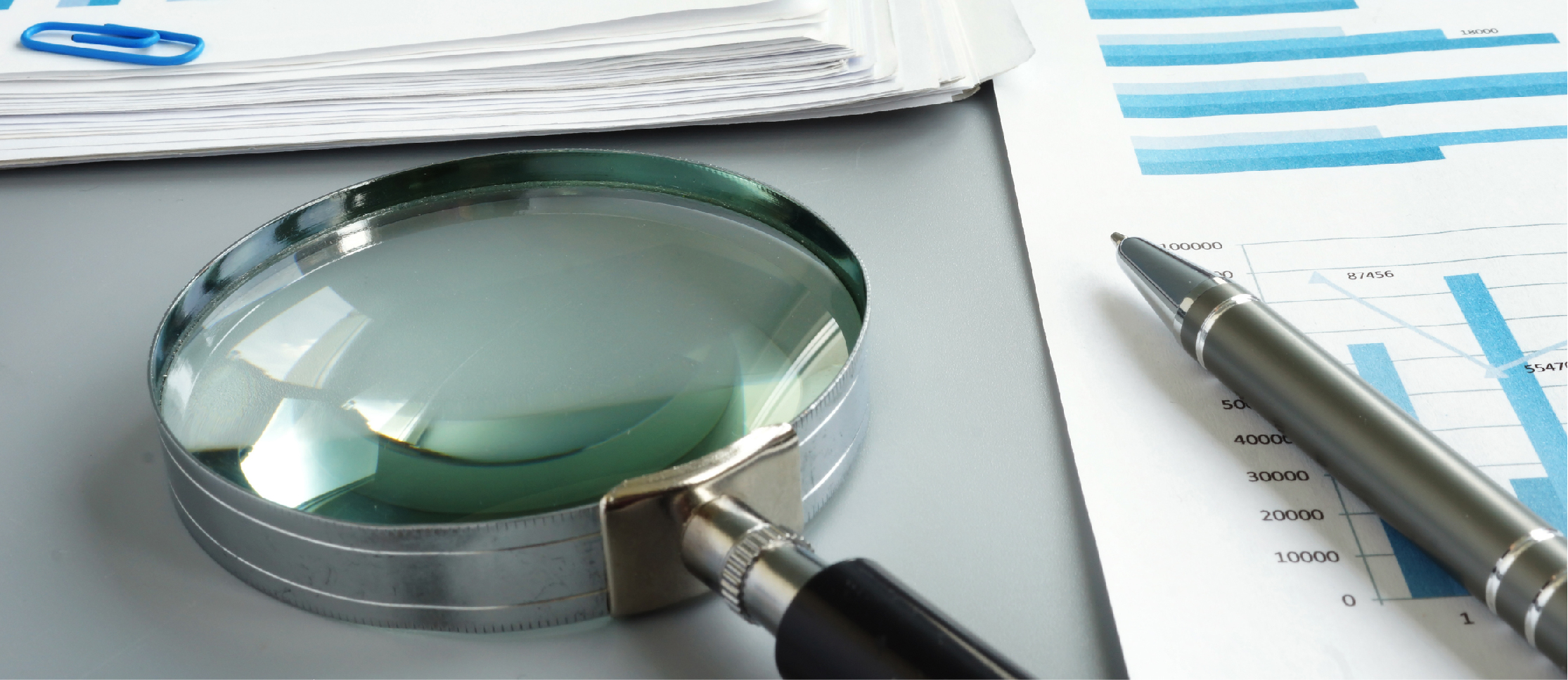 image of magnifying glass and documents